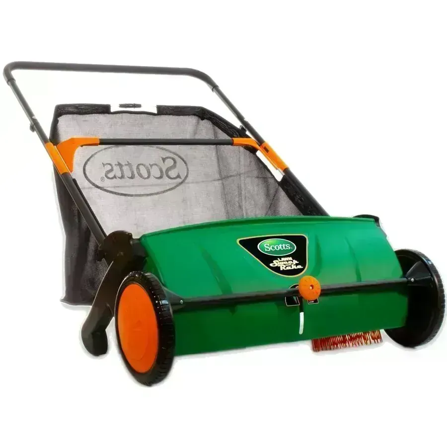 Scotts 26 inch Sweep-It Push Lawn Sweeper with green housing and orange wheels